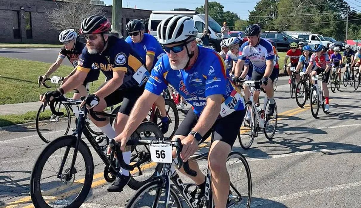 A group of cyclists riding together in a race.